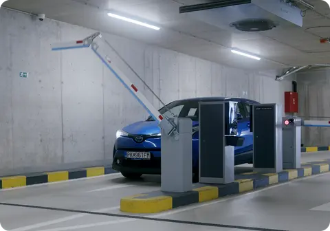 Barrier opening for a car at a car park entrance